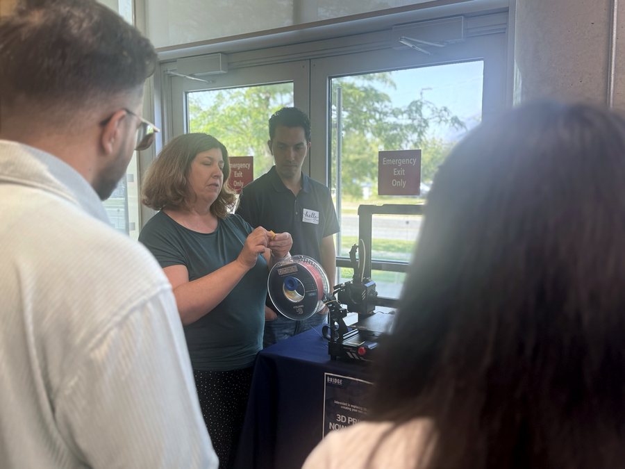 Founders being shown a 3D printer during a lab visit