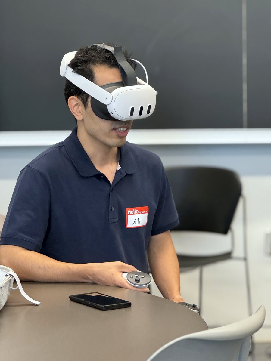 A founder trying a VR headset during a session
