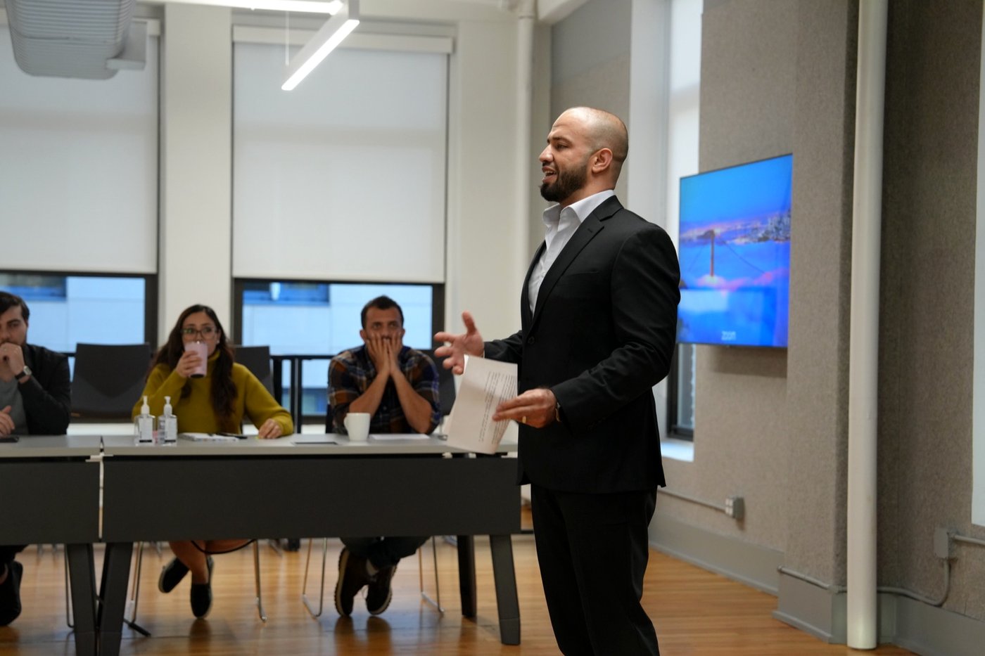 A founder pitching to the panel at graduation